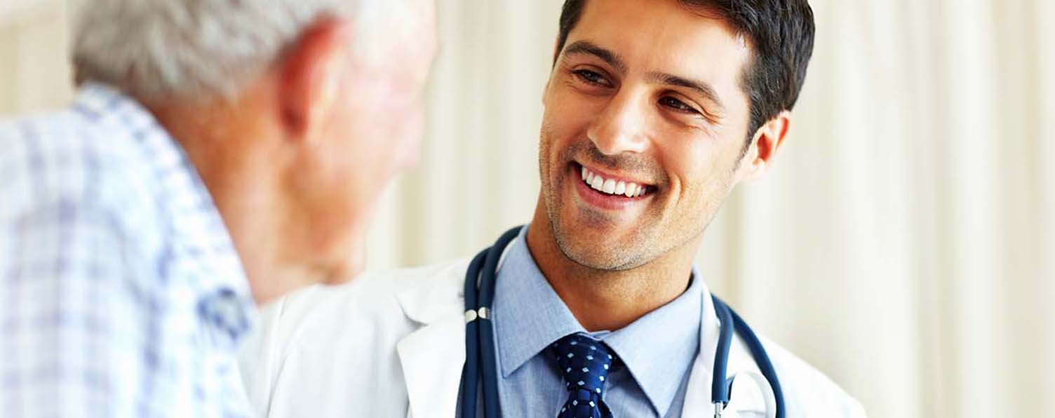 A doctor talks with a senior patient.