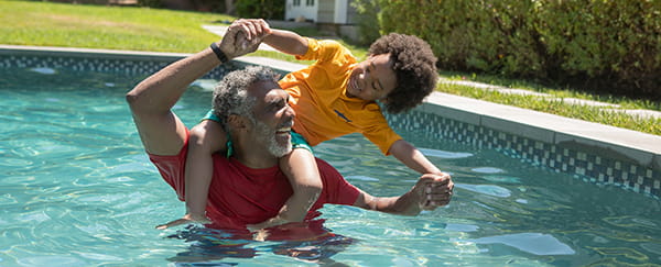 Senior with child in pool